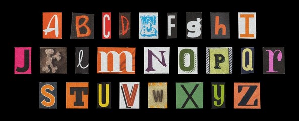 Halloween alphabet set, spooky cut-out letters collage on dark background