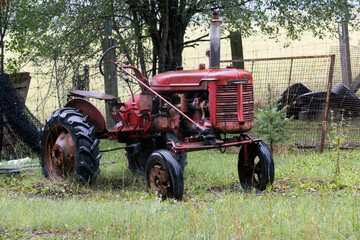 old farm tractor parked in the yard