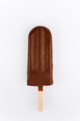 Chocolate ice cream popsicle on wooden stick isolated on white background, studio shot