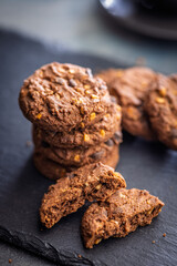 Sweet chocolate cookies on kitchen table.