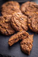 Sweet chocolate cookies on kitchen table.