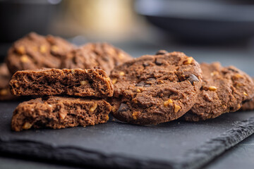 Sweet chocolate cookies on kitchen table.