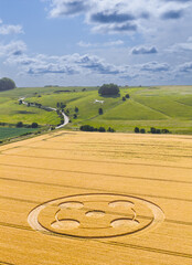Aerial view of a mysterious, intricate, geometric crop art, crop circle formation in a wheat field near Hackpen Hill, Wiltshire, England, UK 
