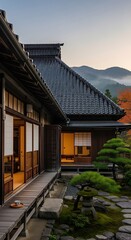 Naklejka premium Japanese architectural vista blending traditional design with serene mountain backdrop in soft light