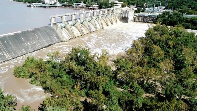 Aerial view of the tom miller dam with floodwaters flowing over the spillway