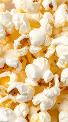 Close-up view of numerous popcorn kernels, showcasing their texture and creamy white color, with hints of golden-yellow interiors.
