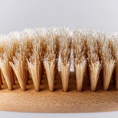 A rectangular yellow cellulose sponge with visible pores and water droplets on a white background