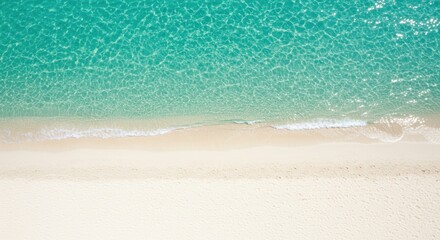 Aerial View of Turquoise Water and White Sand Beach with Footprints