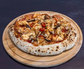 The best pizza in the world, Brazilian shrimp pizza with shiitake mushrooms and red pepper.