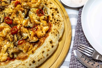 The best pizza in the world, Brazilian shrimp pizza with shiitake mushrooms and red pepper.