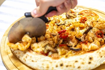 The best pizza in the world, Brazilian shrimp pizza with shiitake mushrooms and red pepper.