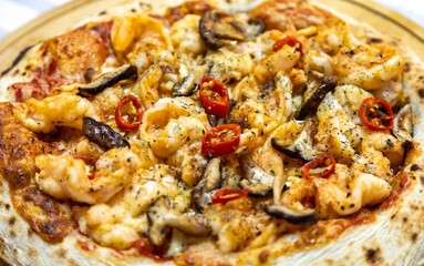The best pizza in the world, Brazilian shrimp pizza with shiitake mushrooms and red pepper.