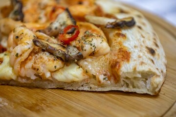 The best pizza in the world, Brazilian shrimp pizza with shiitake mushrooms and red pepper.