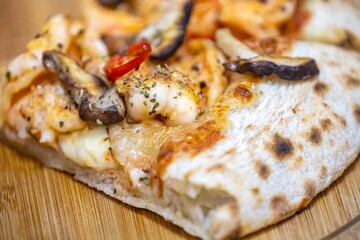 The best pizza in the world, Brazilian shrimp pizza with shiitake mushrooms and red pepper.