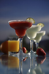 capture essence of top  famous cocktails beside shimmering pool or azure sea