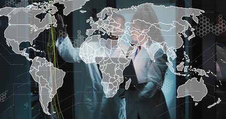 Network engineer and data analyst verifying CAT cable connections with map overlay in data center