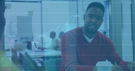Leading Black man in red sweater showing charts in conference room, with digital graph overlay