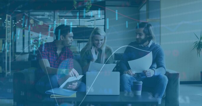 Discussing details colleagues gesturing toward laptop reviewing documents in office lounge - Powered by Adobe