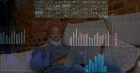 Reviewing financial charts older man examining data on laptop in living room, with chart overlay
