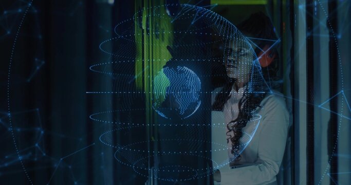 Engineer examining hologram projection with swirling data rings in data center corridor, copy space - Powered by Adobe