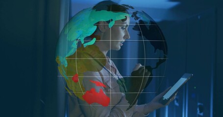 Naklejka premium Interacting technician monitoring networks on tablet in server rack corridor, globe projection