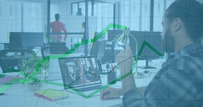 Typing bearded man hosting meeting at open office desk, with laptop desk lamp plant, copy space