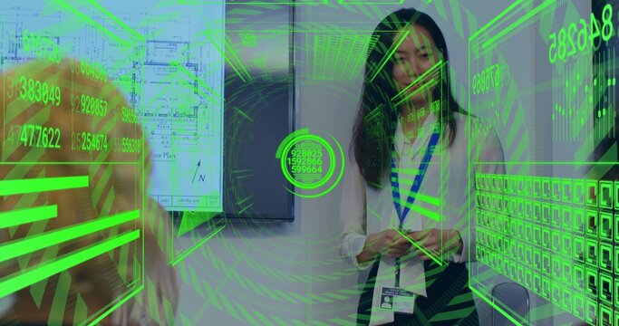 Interacting Chinese woman wearing ID badge scanning AR interface in meeting room, with blueprint