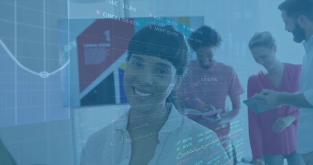 Presenting female analyst displaying financial charts in office, with colleagues using tablets