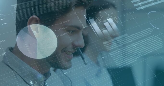 Answering calls male agent speaking with headset and viewing floating data in office, with monitors - Powered by Adobe