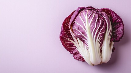 Obraz premium Fresh radicchio on a purple background