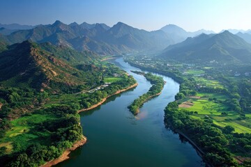 Aerial View Of Winding River Through Mountains And Valley