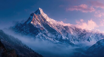 Majestic snow-capped mountain peak at dawn