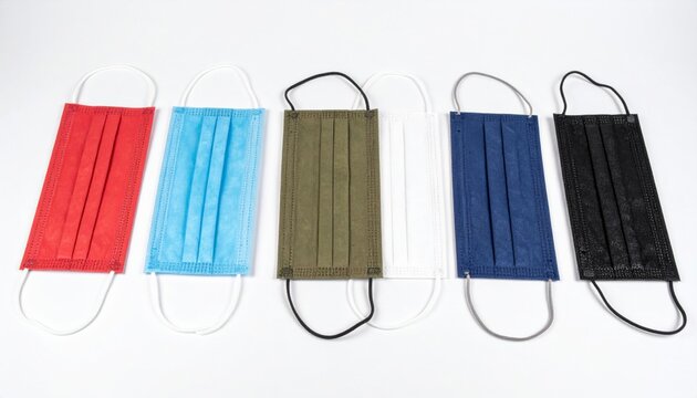 Neat Row of Multicolored Disposable Protective Masks on White Backdrop