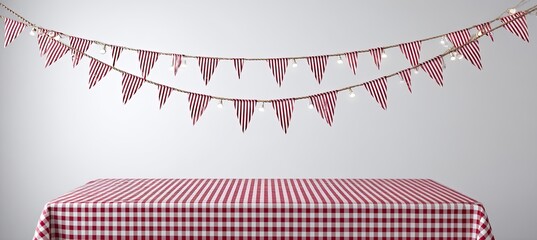 Festive red and white checkered tablecloth with a garland of red and white pennants strung across a light gray background