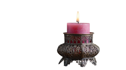 Burning candle in ornate metal holder on white background