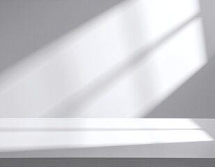 A bright, white table bathed in soft, natural light streaming through a nearby window, casting gentle shadows and illuminating the surface beautifully.