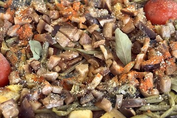 A mixture of meat and vegetables is cooking in a modern pressure cooker closed type on the gas stove