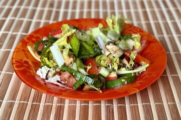 Salad with fresh vegetables like celery, tomatoes, cucumbers, garlic arrows, apples, flax seeds, sesame seeds and sea mussels