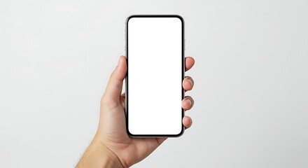 Hand holding a smartphone with a blank white screen against a neutral background.