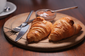Freshly baked croissants with chocolate spread at a cafe