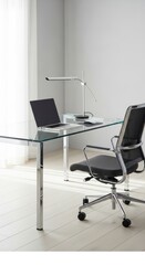 Modern Office Workspace: Minimalist Desk, Laptop, Chair, and Ambient Lighting.