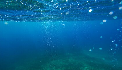 Underwater view of deep blue ocean with bubbles