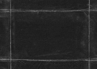 Grunge black paper with frame texture background. Creased old cardboard surface overlay design.