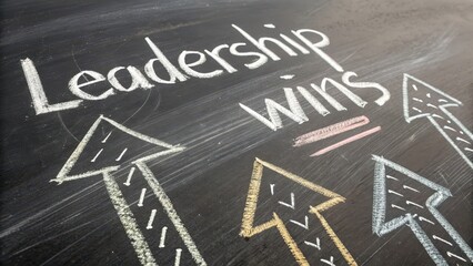 Fototapeta premium Inspiring Leadership Wins Concept with Arrows on Chalkboard Background