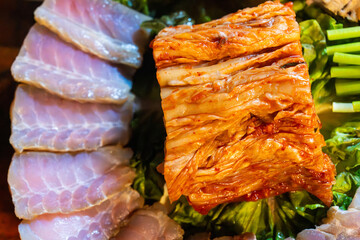 spicy kimchi and fermented skate slices at skate samhap cuisine