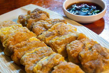 slices of fried fermented skate with soy sauce