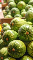 Fresh green zucchini stacked in wooden crates