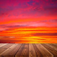 A rustic wooden table top showcases its rich grain, set against a breathtaking sunset sky filled with vibrant oranges, pinks, and purples.