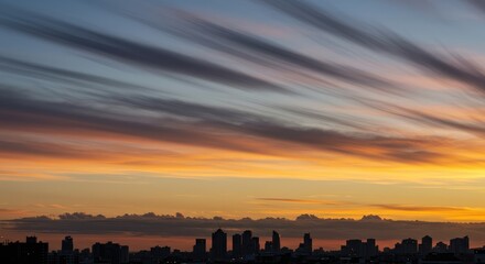 City skyline at sunset with dynamic clouds