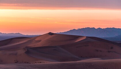 Naklejka premium Sunrise over sand dunes, pastel colors, mountains in distance